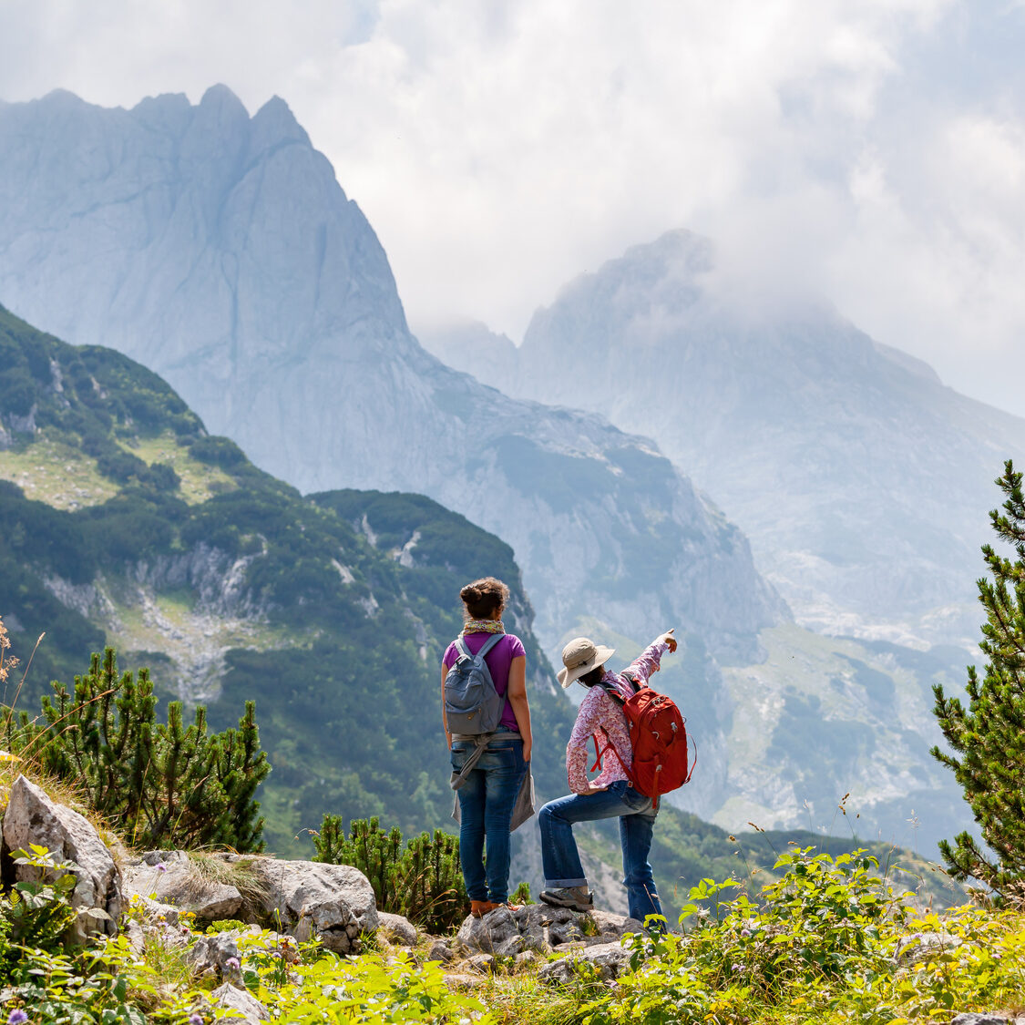 Two people are hiking. Good sunny day in Montenegro. Balkan mountains. Two people are hiking. Good sunny day in Montenegro. Balkan mountains.